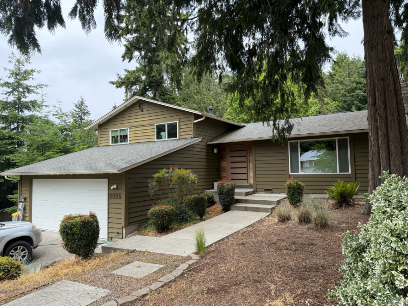Finished olive-green exterior repaint on a Seattle-area home shown from the front